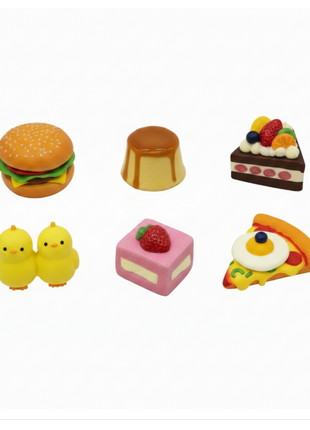 Squishies comida flat lay - 7 variantes kawaii: Hamburguesa, Flan, Pasteles, Mazorca y Pizza slow-rise