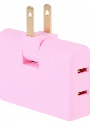Detalle adaptador triple rosa – tres tomas laterales y clavijas doradas – cuerpo compacto de plástico resistente

