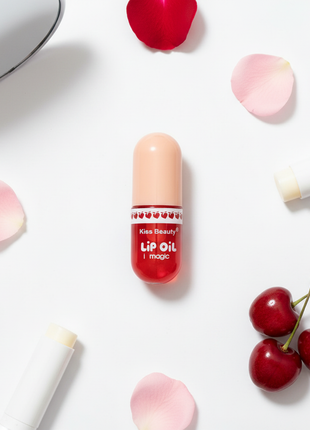 Kiss Beauty Lip Oil – cápsula roja translúcida – aceite labial brillante – diseño único en forma de píldora