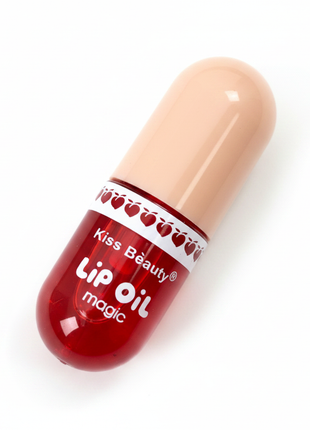 Kiss Beauty Lip Oil – cápsula roja translúcida – aceite labial brillante – diseño único en forma de píldora