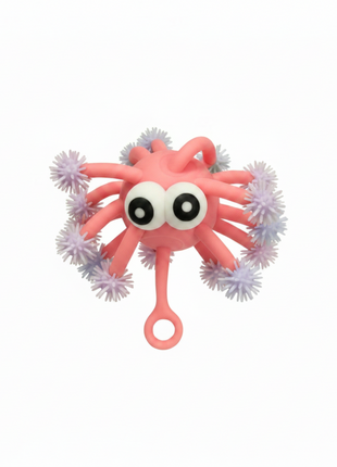 Pulpo puffer sensorial rosa salmón tentáculos pastel ojos grandes antiestrés