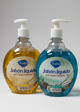 Tópico jabón líquido avena y coco 1L – detalle etiquetas dorada y turquesa – fórmula antibacterial premium
